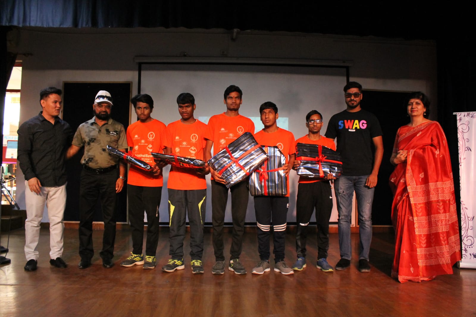 Team on stage with the National Blind Cricket players